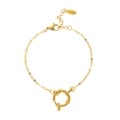 Detail of a golden stainless steel chain bracelet with a large round sailor clasp - Fine Chain Style