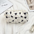 Flat lay of a beige quilted cosmetic bag with cute cartoon motifs and metal zipper detail - Black Cat Puppy (Beige)