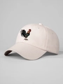 Close-up of rooster embroidery detail on beige cotton baseball cap with twill texture - Beige