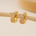 Detailed view of gold butterfly hoop earrings with pavé cubic zirconia on soft background - EH412017 Butterfly Shape
