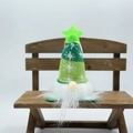 Detail of green knit Christmas gnome with snowflake pattern and glowing star on its hat - Glowing Short Leg Green
