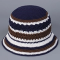 Detail of handmade crochet bucket hat featuring striped knit pattern in navy blue and brown - M (56-58cm) / Navy Color Block