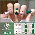 Detailed view of Christmas gel nail stickers with Santa and glitter tree patterns - CS428