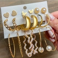 Detail view of a gold alloy earring set featuring butterfly, heart shapes and pearls - Gold Heart Butterfly Pearl Set (53725)