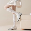 White knee-high socks with black polka dots and vertical ribbing in Japanese college style - Off-white