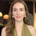 Close-up of bohemian style teardrop raffia tassel earrings worn on female model - Gold/Silver (4# Silver Needle)