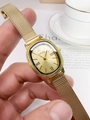 Detail of vintage gold women's watch with rectangular dial and Milanese mesh strap - Gold Steel Strap Gold Dial