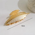 Golden feather-shaped 9cm metal hair claw clip with detailed texture in minimalist style - Feather Leaf