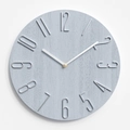 Minimalist round wall clock in light blue wood grain with silver 3D metal numbers - Fog Blue With Silver Plated Numbers