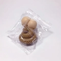 Funny poop shaped silicone tea infuser with brown and beige butt design in packaging - Poop