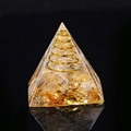 Orgone energy pyramid with yellow crystal chips and golden spiral wire coil - Rutilated Quartz