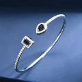 Detail of adjustable silver bracelet with pear and rectangular black gemstones and halo crystals - Black