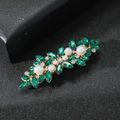 Close-up of green crystal floral hair clip with white pearls and gold metal base - Green Zirconia Style / Gold
