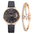 Detail of rose gold moon dial watch with black strap and matching star crystal bracelet - Watch and Bracelet Set / Black