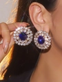 Luxury sparkling earrings with large blue round stone and white crystal halo setting - Blue Round Halo Style