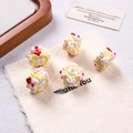 Hand-painted cream resin beads with pink bows and red heart details on linen fabric - White + Yellow Cream + Red Arrow
