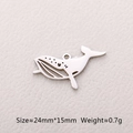 Macro detail of hollow whale tail pendant showing 24mm x 15mm size and 0.7g weight - Whale / Steel