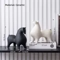Set of two minimalist ceramic horse sculptures in matte black and white finishes - Small Round Horse Set 3 (Black S+White L)