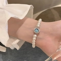 Exquisite pearl bracelet with a round blue gemstone centerpiece and silver metal accents - S029-azure Imitation Pearl Bracelet #sz400