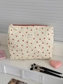 Detailed view of quilted makeup bag with red hearts and secure zip closure - Red Heart - Handheld Pouch