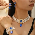 Elegantes mehrlagiges Perlenketten-Set mit blauen Smaragdschliff-Steinen in Goldoptik - Gold Blau