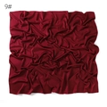 Solid color matte faux silk satin square scarf detail view showing soft fabric texture. - Burgundy