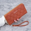 Orange diamond-quilted PU leather long wallet featuring a cartoon bear and wrist strap - Brown