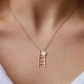 Minimalist gold necklace with geometric step pendant and silver heart charm on model - Gold Step Heart (K-162)