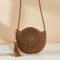 Chic round straw shoulder bag with long tassel in natural woven texture for beach vacation - Camel