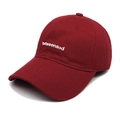 Close-up of white 'betweenaod' embroidery on a red cotton canvas baseball cap - M (56-58cm) / Burgundy