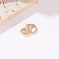 Detailed macro view of 14k gold-plated heart lobster clasps for DIY jewelry making - 14K Gold Round Lobster Clasp H-9181