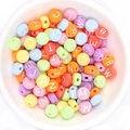Colorful flat round acrylic letter beads in a white bowl for DIY jewelry bracelets - Colorful + White Text