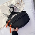 Sleek black canvas chest bag with orange zipper pulls and adjustable nylon strap - Black