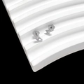 Detailed close-up of silver thunderbolt stud earrings on a wave display stand - Flash