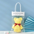 Yellow coral fleece towel folded into a bear shape in a transparent gift bag with ribbon - 30*30cm / Rhubarb