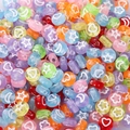 Macro shot of colorful acrylic beads featuring white stars and hearts for DIY jewelry - 4x7mm Transparent Colored Star Moon (100pcs)