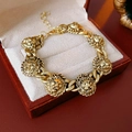 Bronze vintage lion head link bracelet in a premium velvet gift box on wood - Bracelet - Gold