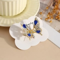 Elegante molletta per capelli a farfalla dorata con strass blu e cristalli lucenti - Blu