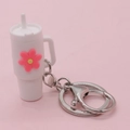 Miniature white tumbler keychain with pink flower charm and silver metal keyring attachment - White Flower Cup Keychain