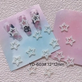 Detailed view of white resin pearl star nail charms with model YD-603 and 12mm size - Star