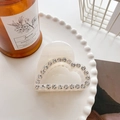Elegant cream heart-shaped hair claw clip with rhinestones on a decorative tray - 5.4cm / White