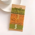 Detail of multi-color high elasticity hair ties set on a craft paper card with beads - Crystal Dark Green Maple Red Set
