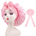 Detailed view of pink satin sleeping cap featuring an elegant bow and long ribbons - Cross-Pink