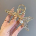 Elegant gold mermaid tail hair claw clip with rhinestones and white pearl detail - Fairy Fish Tail Rhinestone