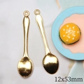 Macro detail of golden metal spoon pendants sized 12x53mm for DIY dollhouse crafts - Large Golden Spoon