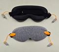 Detail of 3D sleep mask showing knit fabric texture and integrated orange earplugs - Unprinted Style / Light Gray