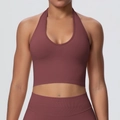 Close-up of halter neck sports bra with deep V-neckline and ribbed texture in dusty rose - Brown
