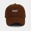 Close-up of white 'hey!' embroidery on a dark brown cotton baseball cap detail - Adjustable / Coffee