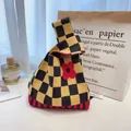 Knit handbag with yellow and black checkerboard pattern and red floral detail - Rose Red Flower