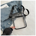 Minimalist transparent PVC crossbody bag with black trim and adjustable nylon shoulder strap - Black